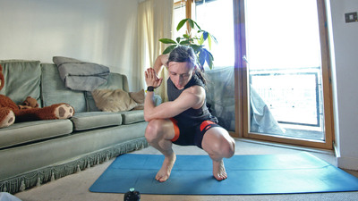 Revolved squat yoga pose