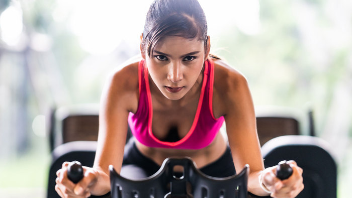 Female athlete on a spin bike