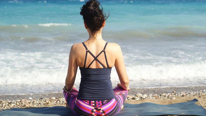 Woman sat on a beach